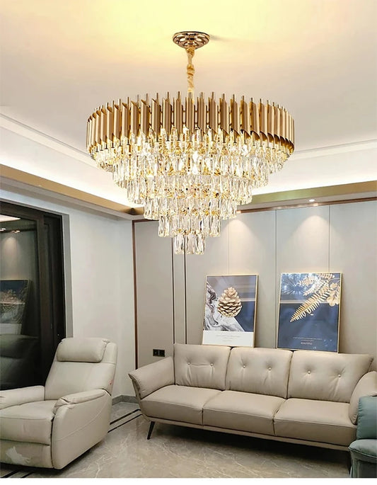 Luxurious living room with a gold chandelier, beige sofa, and armchair.